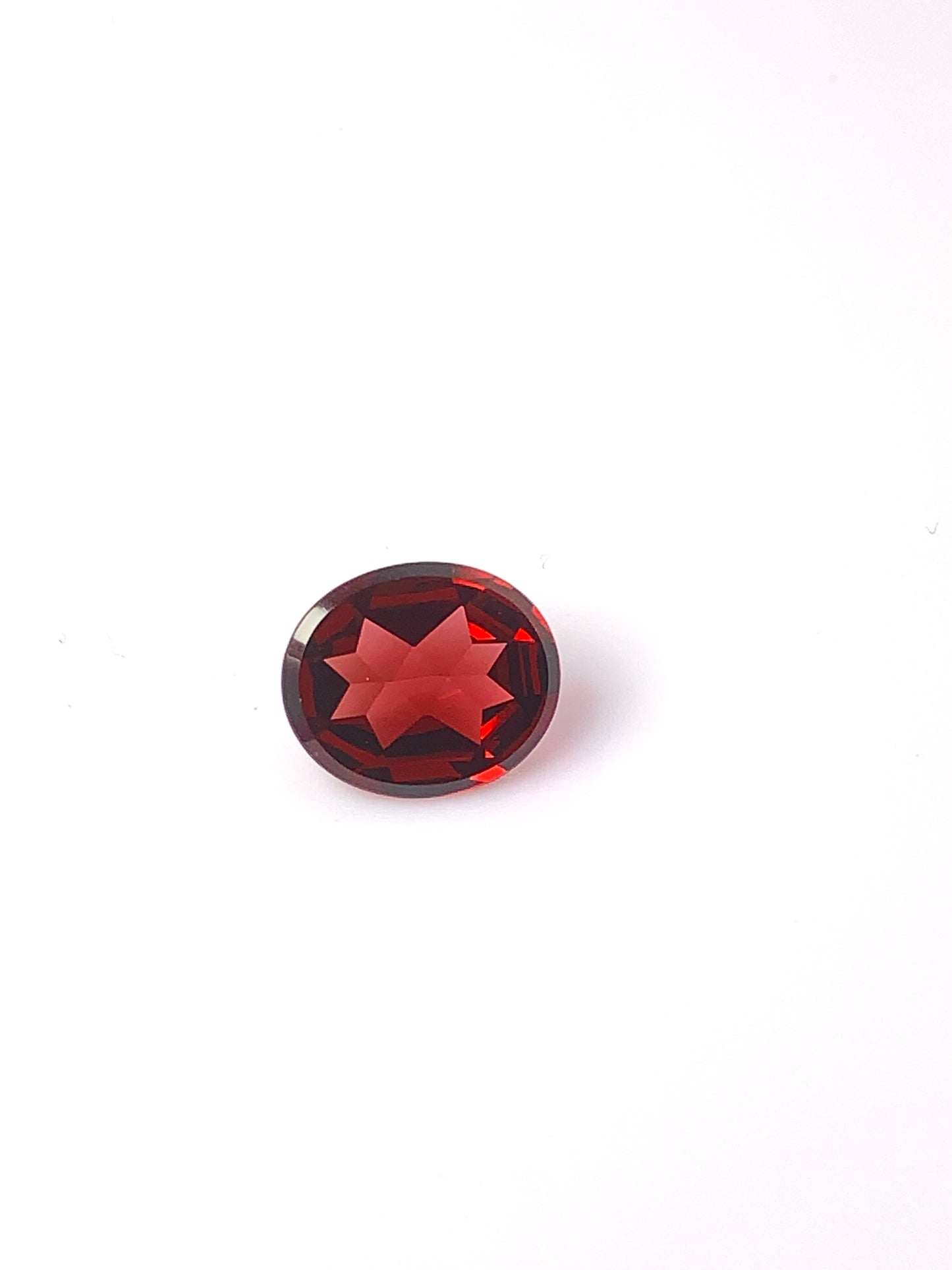 Garnet facetted, bright red color, quality hI, oval