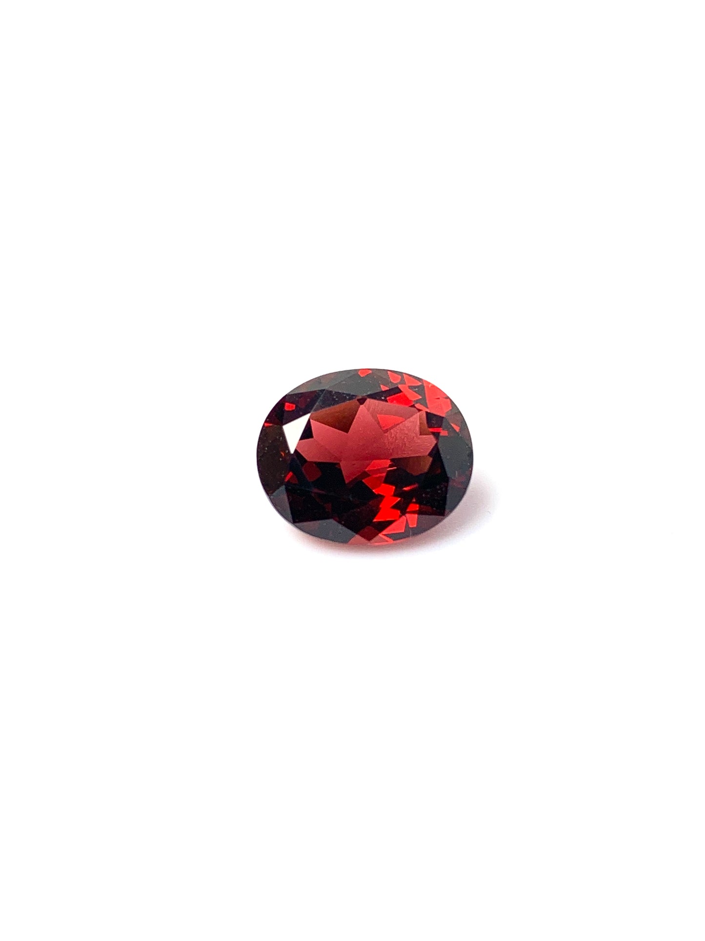 Garnet facetted, bright red color, quality hI, oval